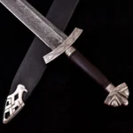 Sharp Norse sword with patterned Damascus blade and wooden handle.