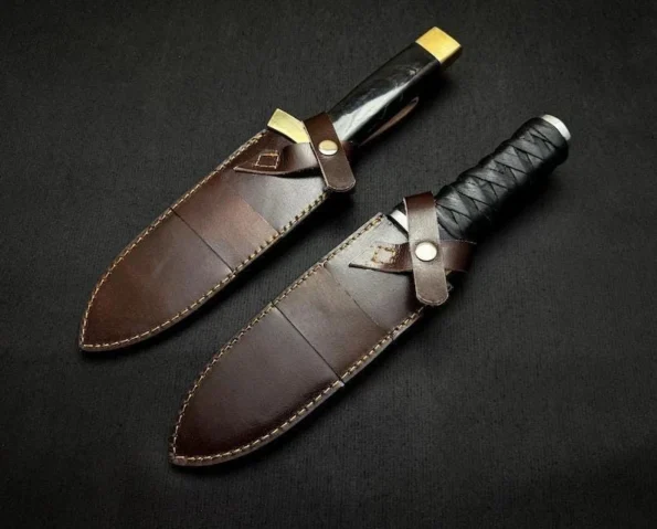 Close-up of the Thorfinn Dual Daggers Replica by Ashblades showing curved D2 steel blade with Norse-inspired proportions and textured leather grip capped with bull horn. Designed for anime fans, collectors, and cosplay warriors seeking cinematic realism and handmade craftsmanship.