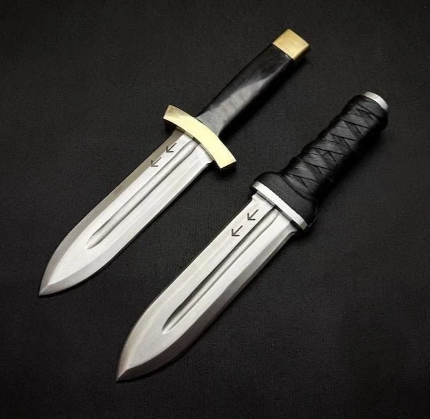 Full-length image of the Thorfinn Dual Daggers Replica by Ashblades, a matching pair of anime-accurate blades inspired by Vinland Saga. Each dagger features a hand-forged D2 steel blade, leather-wrapped grip, and bull horn accents. Ideal for cosplay, anime weapon collections, and Viking-themed fantasy setups.